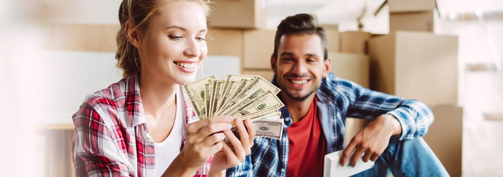 Morrisons Cove 1st FCU woman holding money